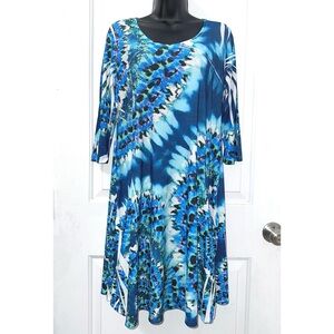 Cover Charge women's dress, featuring a blue, black, and white abstract print